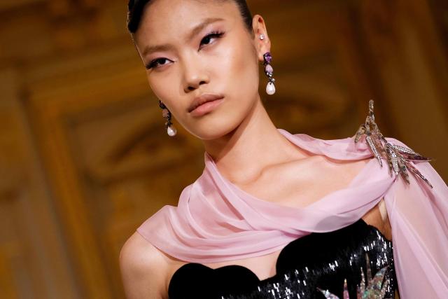 A model presents a creation for Miss Sohee for the Women's Haute Couture Spring/Summer 2026 collection fashion show as part of the Paris Haute Couture Fashion Week, in Paris, on January 29, 2026. (Photo by Ian LANGSDON / AFP)