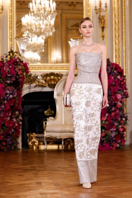 A model presents a creation for Miss Sohee for the Women's Haute Couture Spring/Summer 2026 collection fashion show as part of the Paris Haute Couture Fashion Week, in Paris, on January 29, 2026. (Photo by Ian LANGSDON / AFP)