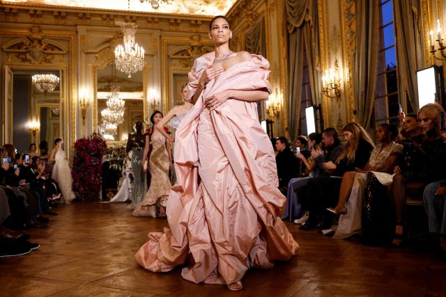A model presents a creation for Miss Sohee for the Women's Haute Couture Spring/Summer 2026 collection fashion show as part of the Paris Haute Couture Fashion Week, in Paris, on January 29, 2026. (Photo by Ian LANGSDON / AFP)