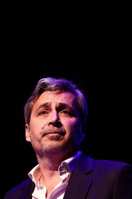French former journalist Olivier Galzi, candidate for the city hall of Avignon, delivers a speech during his first campaign rally for France's upcoming municipal elections in Avignon, southern France, on January 29, 2026. French voters head to the polls for municipal elections on March 15 and 22, 2026. (Photo by Thibaud MORITZ / AFP)