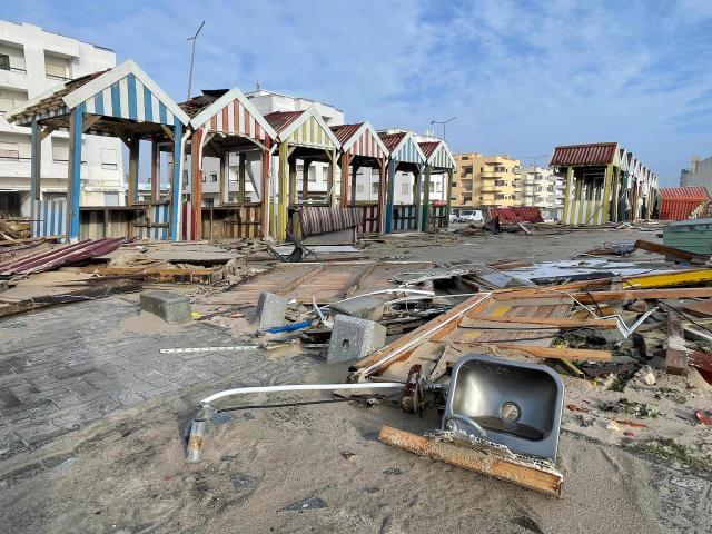 Debris and destroyed cabins are seen in a street of Praia da Vieira, after storm Kristin hit Portugal, on January 29, 2026. Storm Kristin has claimed five lives and left nearly 450,000 clients without power on January 29, more than 24 hours after it barrelled through central and northern Portugal, authorities said. (Photo by Jerome PIN / AFP)