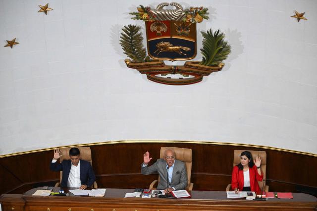 The President of the National Assembly of Venezuela, Jorge Rodriguez (C), and first vice-president Pedro Jose Infante (L) and second vice-president Grecia Colmenares, attend the debate on the Bill for the Partial Reform of the Organic Law on Hydrocarbons during a session at the National Assembly in Caracas on January 29, 2026. (Photo by Federico PARRA / AFP)