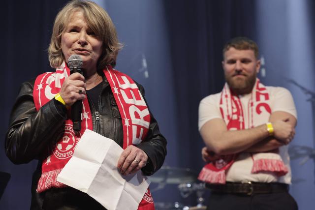 Mother of jailed French journalist Christophe Gleizes, Sylvie Godard (L) delivers a speech during a Reporters Without Borders (RSF) evening in solidarity with jailed French sports journalist Christophe Gleizes at Bataclan music hall in Paris on January 29, 2026. Gleizes was arrested in May 2024 while travelling to northeastern Algeria's Kabylia region to write about the country's most decorated football club, Jeunesse Sportive de Kabylie. (Photo by STEPHANE DE SAKUTIN / AFP)