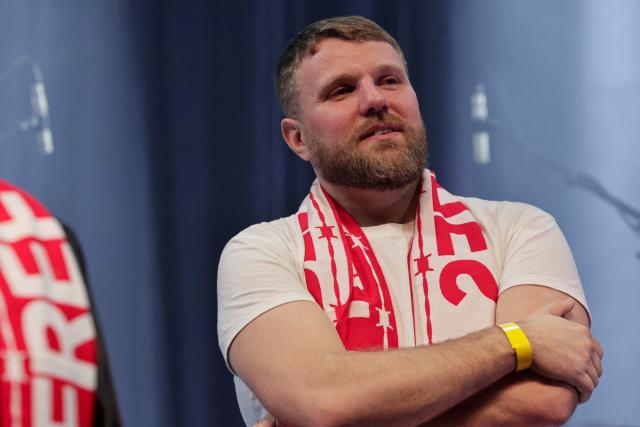 French actor and brother of jailed French sports journalist Christophe Gleizes, Maxime Gleizes looks on during a Reporters Without Borders (RSF) evening in solidarity with jailed French sports journalist Christophe Gleizes at Bataclan music hall in Paris on January 29, 2026. Gleizes was arrested in May 2024 while travelling to northeastern Algeria's Kabylia region to write about the country's most decorated football club, Jeunesse Sportive de Kabylie. (Photo by STEPHANE DE SAKUTIN / AFP)