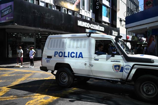 A police vehicle patrols in downtown San Jose on January 29, 2026. Right-wing politician Laura Fernandez appears set to win Costa Rica's presidential election in the first round, according to two opinion polls published on January 21. (Photo by Marvin RECINOS / AFP)