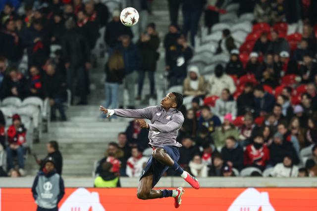Lille's Belgian defender #03 Nathan Ngoy heads the ball as he warms up ahead of the UEFA Europa League - League phase, Matchday 8 - football match between LOSC Lille and SC Freiburg at the Pierre Mauroy Stadium in Villeneuve d'Ascq, northern France, on January 29, 2026. (Photo by Sameer Al-DOUMY / AFP)