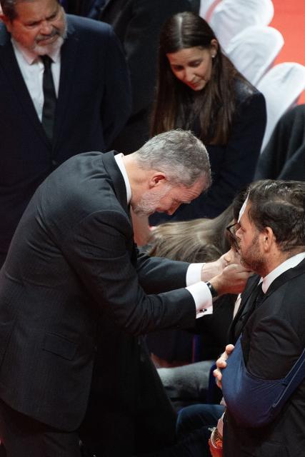 Spain's King Felipe VI meets victims' relatives during a funeral mass for the victims of the trains accident who killed 45 persons in Adamuz, on January 29, 2026, in Huelva. The January 18 accident near the southern village of Adamuz - one of Europe's deadliest rail disasters this century - has raised questions about the country's rail safety. (Photo by JORGE GUERRERO / AFP)