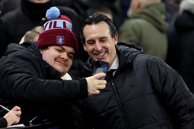 Aston Villa's Spanish manager Unai Emery poses for a selfie photograph with a fan before the UEFA Europa League league-stage football match between Aston Villa and RB Salzburg at Villa Park in Birmingham, central England on January 29, 2026. (Photo by Darren Staples / AFP)