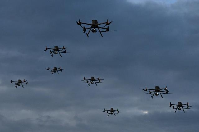 (FILES) This view shows drones during the activation of the first unmanned aircraft battalion at the military base in Tolemaida, Colombia, on October 10, 2025. Colombia has restricted the importation of drones, whose increased use by guerrilla groups in a decades-old conflict killed 20 people last year and wounded nearly 300, the government said on January 29, 2026. (Photo by Raul ARBOLEDA / AFP)
