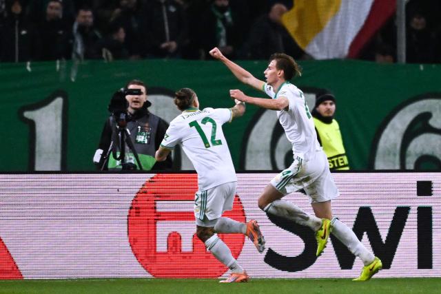PRoma's polish defender #24 Jan Ziolkowski (R) celebrates scoring his team's first goal during the UEFA Europa League - League phase, Matchday 8 - football match between Panathinaikos FC and AS Roma at the Olympic Stadium in Athens on January 29, 2026. (Photo by Aris MESSINIS / AFP)
