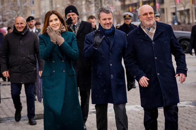 King Frederik X of Denmark (2C) and Queen Mary of Denmark (2L) gesture as they walk with Speaker of Lithuania's Parliament Juozas Olekas (R) in Vilnius, Lithuania, on January 29, 2026. The Danish royal couple is on a state visit to Lithuania from January 28 to 29, 2026. His Majesty the King will travel to Greenland from February 18 to 20, 2026, the court announced. (Photo by Ida Marie Odgaard / Ritzau Scanpix / AFP) / Denmark OUT