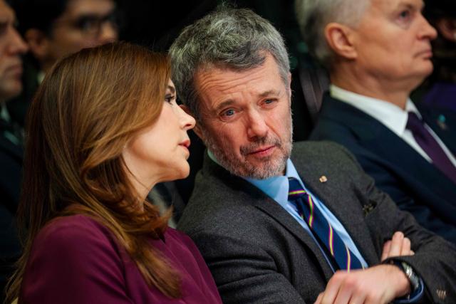 Queen Mary of Denmark (L) and King Frederik X of Denmark (C) talk during the opening of a Danish-Lithuanian business forum focusing on energy, defense, and security at the Energy and Technology Museum in Vilnius, Lithuania, on January 29, 2026. The Danish royal couple is on a state visit to Lithuania from January 28 to 29, 2026. His Majesty the King will travel to Greenland from February 18 to 20, 2026, the court announced. (Photo by Ida Marie Odgaard / Ritzau Scanpix / AFP) / Denmark OUT