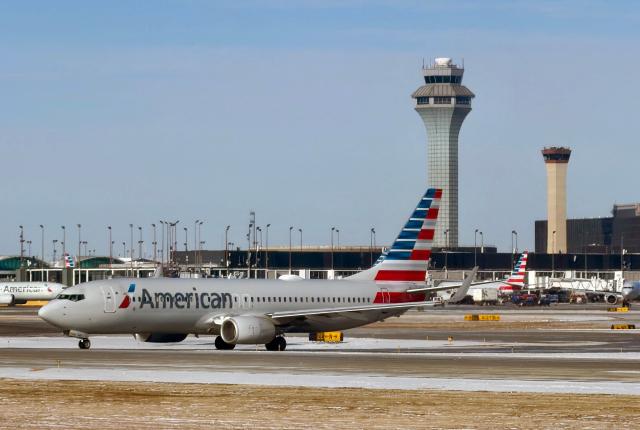 (FILES) An American Airlines plane taxis at Chicago O'Hare International Airport in the northwest side of Chicago, Illinois on January 15, 2026. US President Donald Trump said he had ordered commercial airspace over Venezuela to be reopened January 29, nearly four weeks after the US military operation to topple Nicolas Maduro. American Airlines announced plans to reinstate service, saying it was in contact with US officials and would schedule flights "pending government approval and security assessments." (Photo by Daniel SLIM / AFP)
