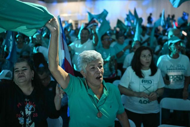 Supporters of Costa Rica’s Sovereign People party presidential candidate Laura Fernandez attends her campaign closing event in San Jose on January 29, 2026. Costa Rica will hold a presidential election on February 1, 2026. (Photo by Marvin RECINOS / AFP)