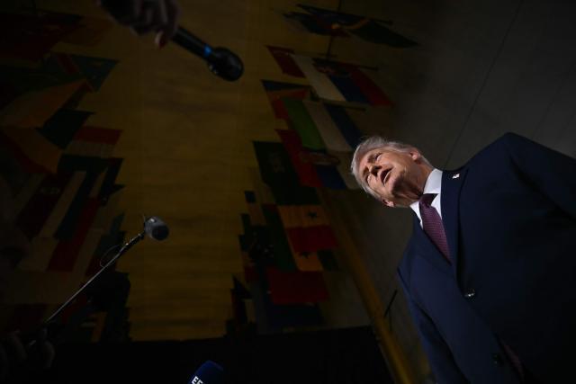 US President Donald Trump speaks to journalists as he attends the world premiere of Amazon MGM Studios' "Melania" at the Kennedy Center in Washington, DC, on January 29, 2026. (Photo by Brendan SMIALOWSKI / AFP)