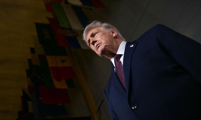 US President Donald Trump speaks to journalists as he attends the world premiere of Amazon MGM Studios' "Melania" at the Kennedy Center in Washington, DC, on January 29, 2026. (Photo by Brendan SMIALOWSKI / AFP)