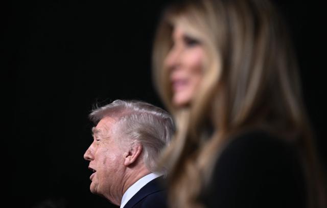 US President Donald Trump and US First Lady Melania Trump speak to journalists as they attend the world premiere of Amazon MGM Studios' "Melania" at the Kennedy Center in Washington, DC, on January 29, 2026. (Photo by Brendan SMIALOWSKI / AFP)