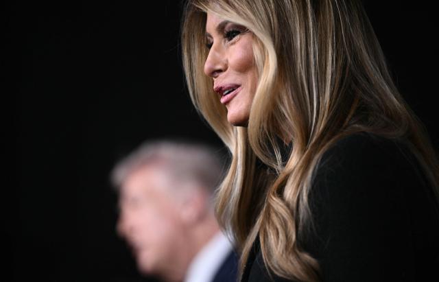 US President Donald Trump and US First Lady Melania Trump speak to journalists as they attend the world premiere of Amazon MGM Studios' "Melania" at the Kennedy Center in Washington, DC, on January 29, 2026. (Photo by Brendan SMIALOWSKI / AFP)