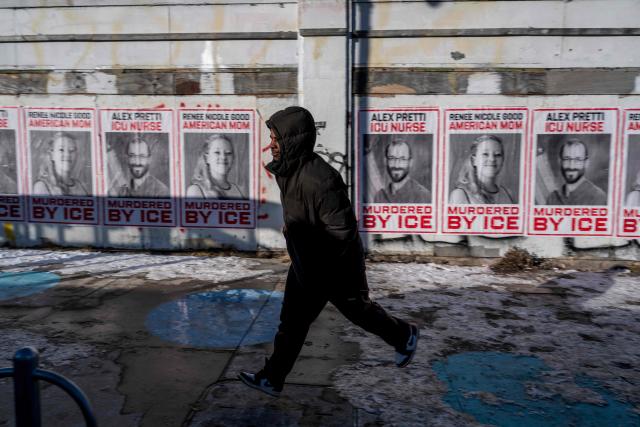 A man runs past posters with images of Renne Good and Alex Pretti, the two US citizens recently shot and killed by federal immigration officers, in Minneapolis, Minnesota on January 29, 2026.


Banners to protest against US Immigration and Customs Enforcement (ICE) are placed at the entrance of a neighborhood in Minneapolis, Minnesota, on January 29, 2026.. US President Donald Trump's border chief Tom Homan said on January 29 that some federal agents could be withdrawn from Minneapolis, the northern US city that has become the flashpoint for the president's immigration crackdown. The Trump administration, facing a public backlash over the shooting deaths of two Americans by federal agents in Minneapolis, also eased immigration operations in the northeastern state of Maine. (Photo by ROBERTO SCHMIDT / AFP)