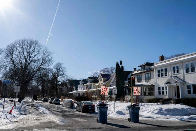 Banners to protest against US Immigration and Customs Enforcement (ICE) are placed at the entrance of a neighborhood in Minneapolis, Minnesota, on January 29, 2026. US President Donald Trump's border chief Tom Homan said on January 29 that some federal agents could be withdrawn from Minneapolis, the northern US city that has become the flashpoint for the president's immigration crackdown. The Trump administration, facing a public backlash over the shooting deaths of two Americans by federal agents in Minneapolis, also eased immigration operations in the northeastern state of Maine. (Photo by ROBERTO SCHMIDT / AFP)