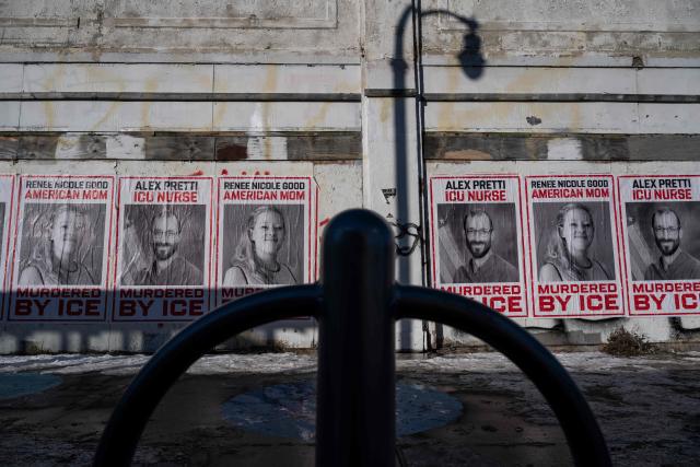 Posters with images of Renne Good and Alex Pretti, the two US citizens recently shot and killed by federal immigration officers, are seen at a street in Minneapolis, Minnesota, on January 29, 2026. US President Donald Trump's border chief Tom Homan said on January 29 that some federal agents could be withdrawn from Minneapolis, the northern US city that has become the flashpoint for the president's immigration crackdown. The Trump administration, facing a public backlash over the shooting deaths of two Americans by federal agents in Minneapolis, also eased immigration operations in the northeastern state of Maine. (Photo by ROBERTO SCHMIDT / AFP)