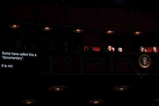 The telepromter shows the words being read by US First Lady Melania Trump (out of frame) as US President Donald Trump (L) and guests listen during the world premiere of Amazon MGM Studios' "Melania" at the Kennedy Center in Washington, DC, on January 29, 2026. (Photo by Brendan SMIALOWSKI / AFP)