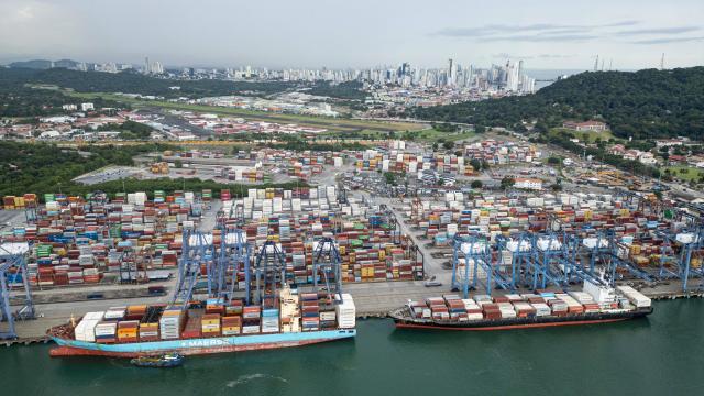 (FILES) This aerial view shows the Port of Balboa at the Pacific entrance of the Panama Canal in Panama City on October 6, 2025. The Panamanian Supreme Court annulled the concession whereby Hong Kong company CK Hutchison Holdings operates two ports on the Panama Canal, the court announced on January 29, 2026, following threats by US President Donald Trump to reclaim the waterway, claiming that it is controlled by China. (Photo by MARTIN BERNETTI / AFP)