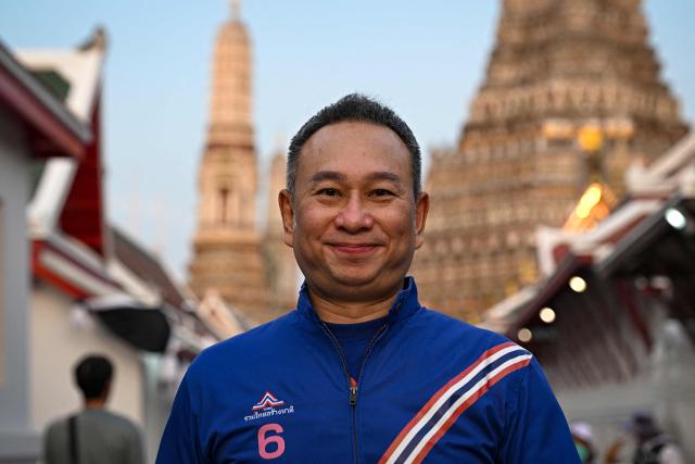 Former snooker player Wattana Pu-Ob-Orm, known professionally as James Wattana, campaigns for the United Thai Nation Party ahead of the general election in Bangkok on January 29, 2026. (Photo by Lillian SUWANRUMPHA / AFP)