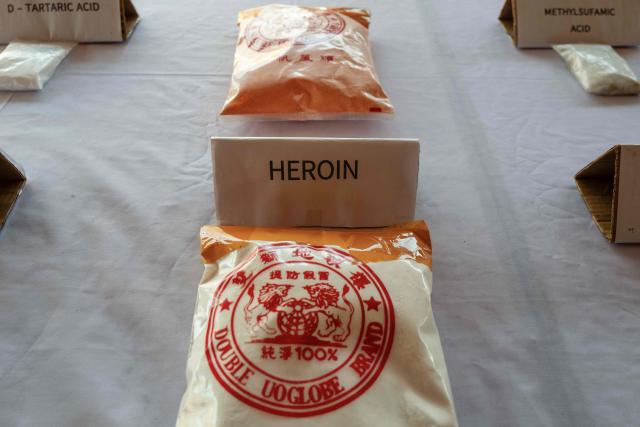 In this photo taken on January 24, 2026, a bag of heroin is displayed during a press tour of a drug production site southwest of Mongyai, northern Shan State, that was captured by the Myanmar military. The Southeast Asian country has long been a hive for illegal drug trade, but analysts say the civil war triggered by a 2021 military coup has increased production and trafficking. (Photo by ANTHONY WALLACE / AFP)