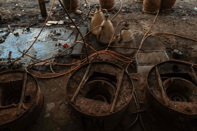In this photo taken on January 24, 2026, furnaces are seen next to glass flasks during a press tour of a drug production site southwest of Mongyai, northern Shan State, that was captured by the Myanmar military. The Southeast Asian country has long been a hive for illegal drug trade, but analysts say the civil war triggered by a 2021 military coup has increased production and trafficking. (Photo by ANTHONY WALLACE / AFP)
