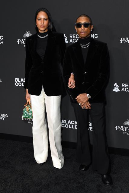 US musician and record producer Pharrell Williams (R) and his wife model Helen Lasichanh attend the Recording Academy Honors Black Music Collective at the Fairmont Century Plaza in Los Angeles on January 29, 2026. (Photo by Unique Nicole / AFP)
