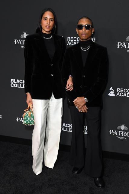 US musician and record producer Pharrell Williams (R) and his wife model Helen Lasichanh attend the Recording Academy Honors Black Music Collective at the Fairmont Century Plaza in Los Angeles on January 29, 2026. (Photo by Unique Nicole / AFP)