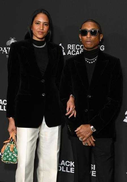 US musician and record producer Pharrell Williams (R) and his wife model Helen Lasichanh attend the Recording Academy Honors Black Music Collective at the Fairmont Century Plaza in Los Angeles on January 29, 2026. (Photo by Unique Nicole / AFP)