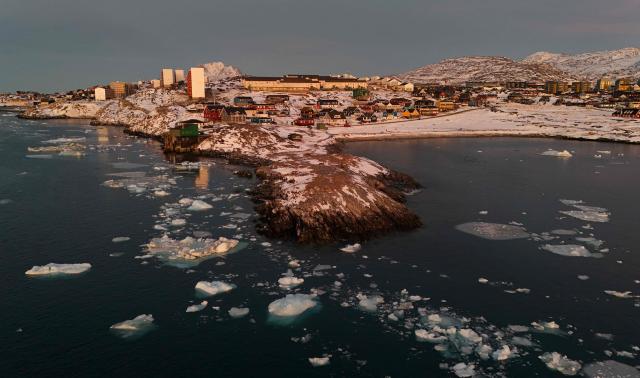 An aerial view shows  ice blocks in the water near the coastline of the city of Nuuk, Greenland on January 29, 2026. (Photo by Ina FASSBENDER / AFP)