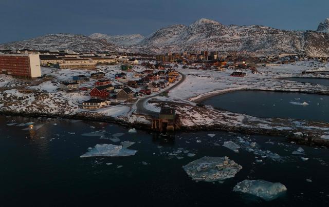 An aerial view taken with a drone shows ice blocks at the coastline in Nuuk, Greenland on January 29, 2026. (Photo by Ina FASSBENDER / AFP)