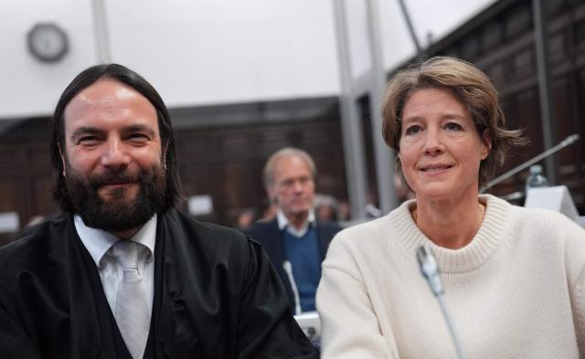 Defendant German entrepreneur and gastronome Christina Block (R) is seen next to her lawyer Ingo Bott as she waits for the continuation her trial over alleged child abduction at the District Court in Hamburg, northern Germany, on January 30, 2026. The public prosecutor's office accuses Block, heiress of a steakhouse chain, of ordering the abduction of her daughter, born in 2010, and her son, born in 2013. According to the indictment, the background to this is an escalating custody dispute over many years between Block and her former husband, who have four children together. (Photo by Marcus Brandt / POOL / AFP)