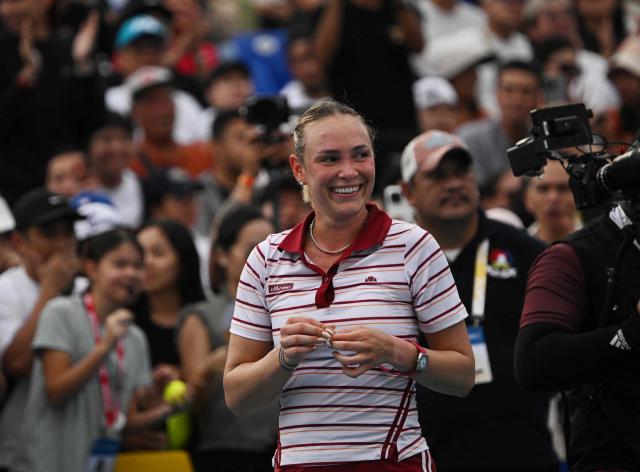 Donna Vekic of Croatia acknowledges the crowd after winning against Tatiana Prozorova of Russia during the semi-finals of women's singles at the Philippine Women's Open tennis tournament in Manila on January 30, 2026. (Photo by Ted ALJIBE / AFP)