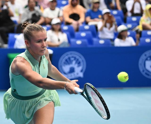 Tatiana Prozorova of Russia hits a return against Donna Vekic of Croatia during the semi-finals women's singles at the Philippine Women's Open tennis tournament in Manila on January 30, 2026. (Photo by Ted ALJIBE / AFP)