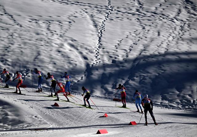 Athletes compete during the first run of men's Normal Hill Mass Start event at the FIS Ski Nordic Combined World Cup, on January 30, 2026 in Seefeld, Austria. (Photo by BARBARA GINDL / APA / AFP) / Austria OUT