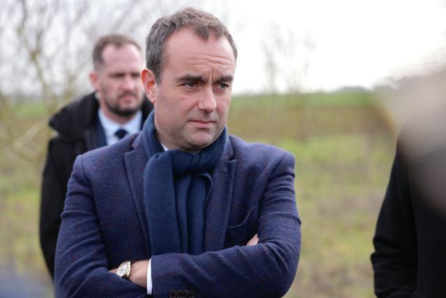 France's Prime Minister Sebastien Lecornu meets with farmers as he tours an almond orchard during a visit to promote local and diversified agriculture, in Baigneaux, central France, on January 30, 2026. The prime minister is visiting the Eure-et-Loire department to launch the "contracts for the future" demanded by the Jeunes Agriculteurs (Young Farmers) union, aimed at diversifying production, notably in the face of climate change, and to present the Governments efforts to increase the share of local food in public procurement. (Photo by Thomas SAMSON / AFP)