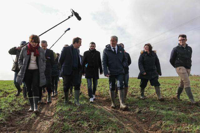 (From L) France's Agriculture Minister Annie Genevard, Prefect  of the Eure-et-Loir department Herve Jonathan, France's Prime Minister Sebastien Lecornu, French agricultural union 'Jeunes agriculteurs' (JA) president Pierrick Horel and Les Democrates' MP Philippe Vigier tour an almond orchard during a visit to promote local and diversified agriculture, in Baigneaux, central France, on January 30, 2026. The prime minister is visiting the Eure-et-Loire department to launch the "contracts for the future" demanded by the Jeunes Agriculteurs (Young Farmers) union, aimed at diversifying production, notably in the face of climate change, and to present the Governments efforts to increase the share of local food in public procurement. (Photo by Thomas SAMSON / AFP)