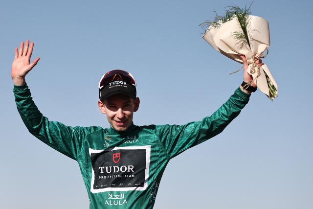 XDS Astana Team italian Matteo Malucelli celebrates on the podium after winning the fourth stage of the AlUla Tour cycling race, 173,4 km from Winter Park to Hegra on January 30, 2026. (Photo by Anne-Christine POUJOULAT / AFP)
