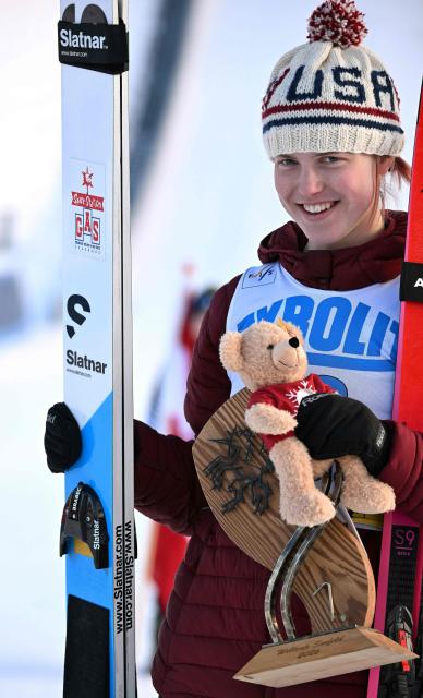 First placed US's Alexa Brabec celebrates with the trophy on the podium after winning the women's Normal Hill Mass Start event at the FIS Ski Nordic Combined World Cup, on January 30, 2026 in Seefeld, Austria. (Photo by BARBARA GINDL / APA / AFP) / Austria OUT
