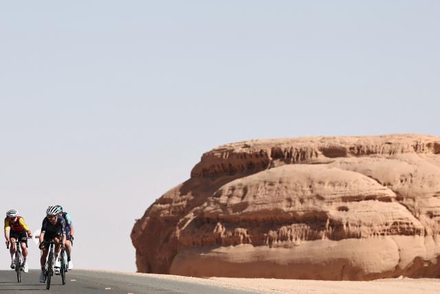 Riders compete in the fourth stage of the AlUla Tour cycling race, 173,4 km from Winter Park to Hegra on January 30, 2026. (Photo by Anne-Christine POUJOULAT / AFP)