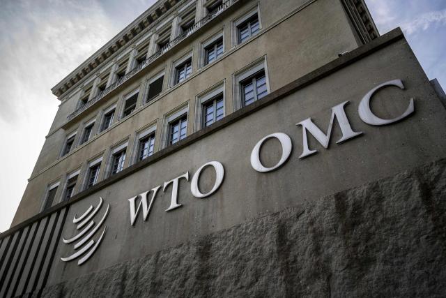 (FILES) A picture taken on February 5, 2024, shows the logo of the intergovernmental World Trade Organization (WTO) at its headquarters in Geneva. The World Trade Organization has faulted the United States in a dispute brought by China over US green energy subsidies introduced under former president Joe Biden, according to the ruling issued on January 30, 2026. The global trade body's dispute panel said that large tax credits granted under Biden's landmark climate law, the Inflation Reduction Act, were "inconsistent" with several WTO agreements, and said it "recommends that the United States withdraw (them) by October 1, 2026 at the latest". (Photo by Fabrice COFFRINI / AFP)