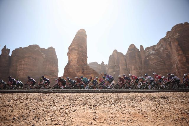 The pack competes in the fourth stage of the AlUla Tour cycling race, 173,4 km from Winter Park to Hegra on January 30, 2026. (Photo by Anne-Christine POUJOULAT / AFP)