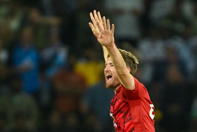 England's Liam Dawson celebrates after taking the wicket of Sri Lanka's Janith Liyanage during the first Twenty20 international cricket match between Sri Lanka and England at the Pallekele International Cricket Stadium in Kandy on January 30, 2026. (Photo by Ishara S. KODIKARA / AFP)