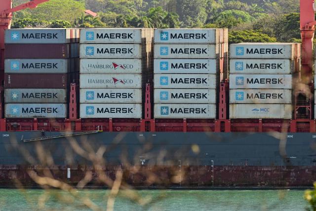 A cargo ship transports containers of the Danish company Maersk in front of the port of Balboa in Panama City January 30, 2026. Panama is in contact with the Danish company Maersk about temporarily taking over two ports operated by Hong Kong firm CK Hutchison, whose concession was annulled by the courts, Panamanian President Jose Raul Mulino said on January 30. (Photo by MARTIN BERNETTI / AFP)