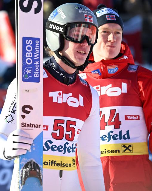 Norway's Andreas Skoglund (L) reacts near Norway's Jens Luraas Oftebro after competing at the men's Normal Hill Mass Start event at the FIS Ski Nordic Combined World Cup, on January 30, 2026 in Seefeld, Austria. (Photo by BARBARA GINDL / APA / AFP) / Austria OUT