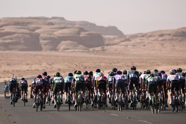 The pack competes in the fourth stage of the AlUla Tour cycling race, 173,4 km from Winter Park to Hegra on January 30, 2026. (Photo by Anne-Christine POUJOULAT / AFP)